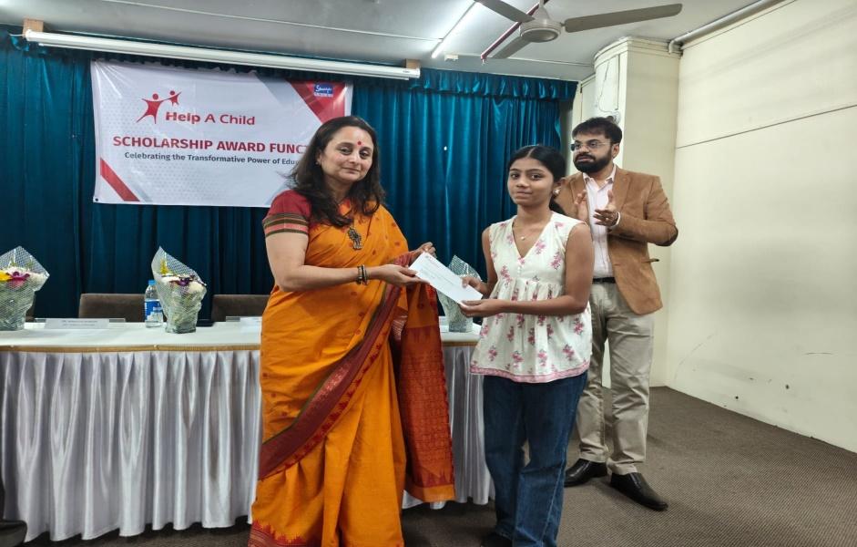 Scholarship cheque awarding to beneficiary student